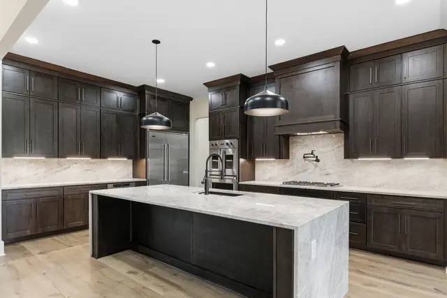 Charcoal kitchen with a full-height cabinet wall