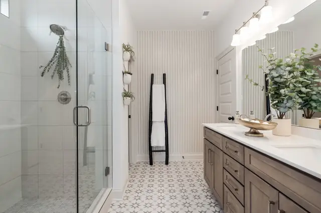 Flat Iron vanity in a primary bath with a walk-in shower