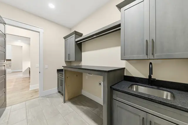 Flat Iron mudroom lockers and a utility sink cabinet