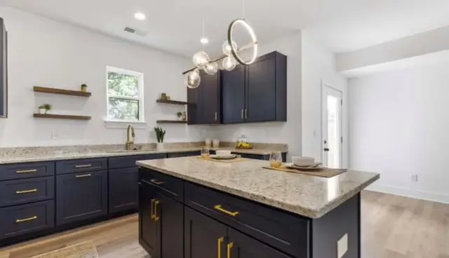 Naval kitchen with brass hardware and open shelving