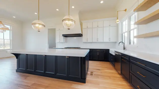 Naval island and base cabinets with Timberland White uppers