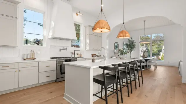 Island seating under a vaulted ceiling