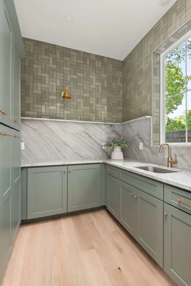 Pewter Green prep pantry with a marble backsplash