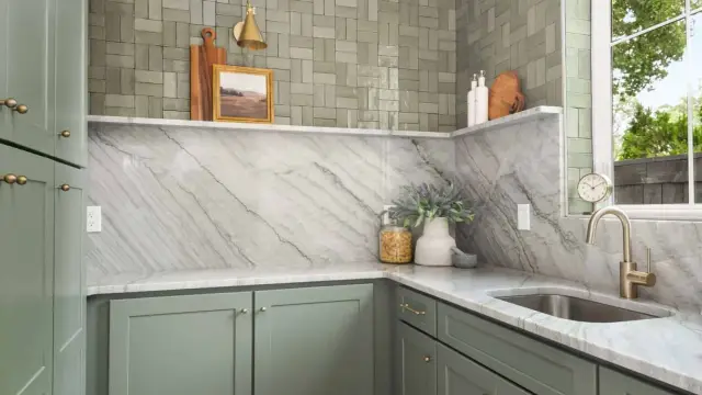 Pewter Green pantry with a marble backsplash and brass tap
