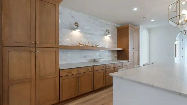 Sand built-in cabinetry with floating shelves