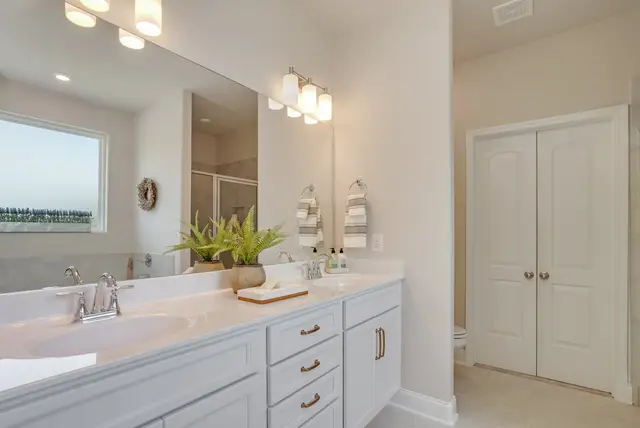 Timberland White vanity with a drop-in tub and double sinks