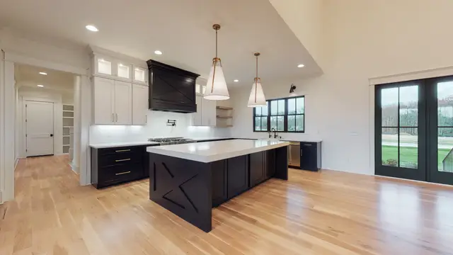 Timberland White kitchen with an X-detail Black island