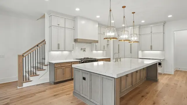 Timberland White cabinetry with a Flat Iron island