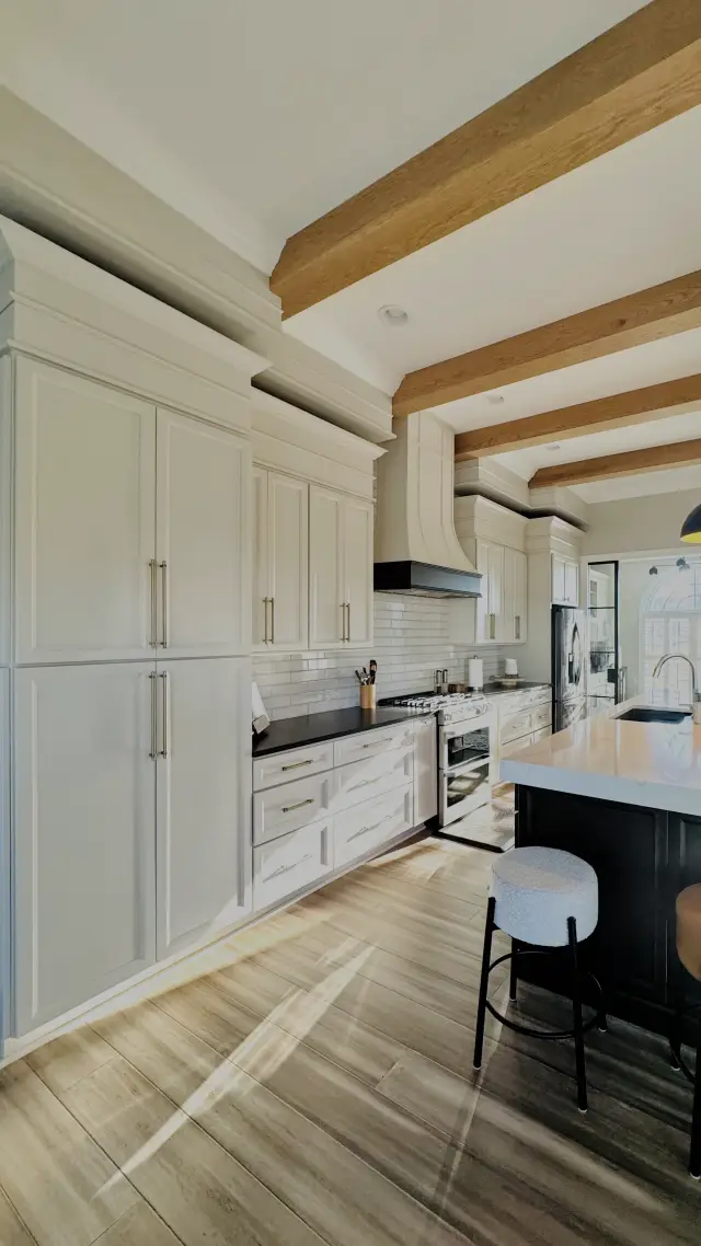 Floor-to-ceiling Oyster pantry cabinetry beside the range
