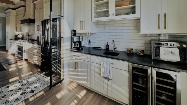 Beverage run with glass uppers over a dark countertop